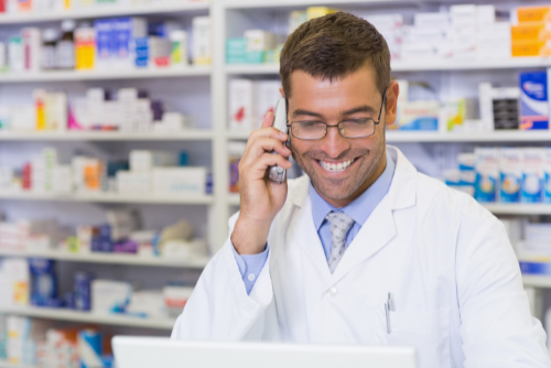 Smiling Pharmacist on Phone Smiling Pharmacist on Phone